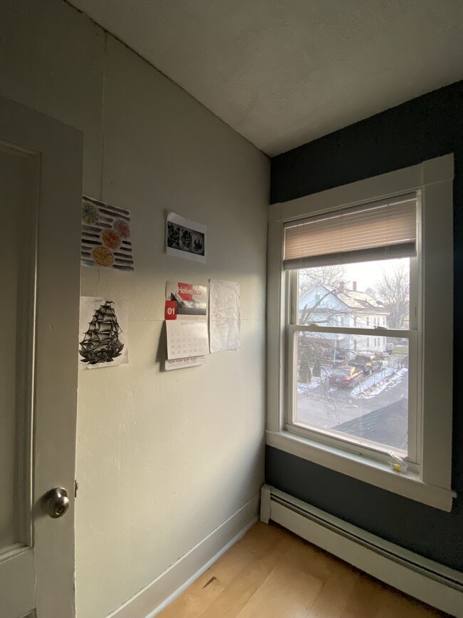 2nd floor Office/Bedroom with hardwood floor and bulletin board wall. - 16 Eames St