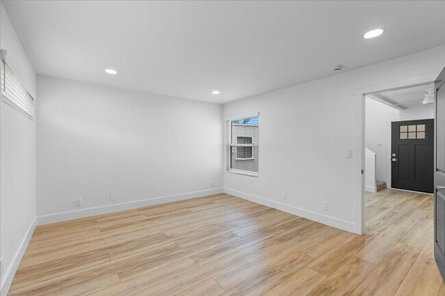 Building Photo - COMPLETELY REMODELED, BRIGHT & AIRY, TRI-LEVEL HOME W/ TOP-FLOOR GREAT ROOM LIVING SPACE, 2-CAR G...