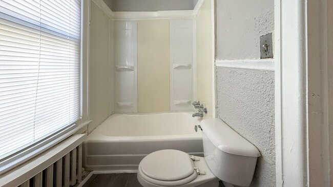 Building Photo - Classic 2-BR Rowhouse with Exposed Brick in Hunting Park