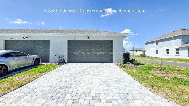 Building Photo - EXCEPTIONAL AND SPACIOUS FURNISHED TOWNHOME WITHIN WATERSIDE- NAUTIQUE!