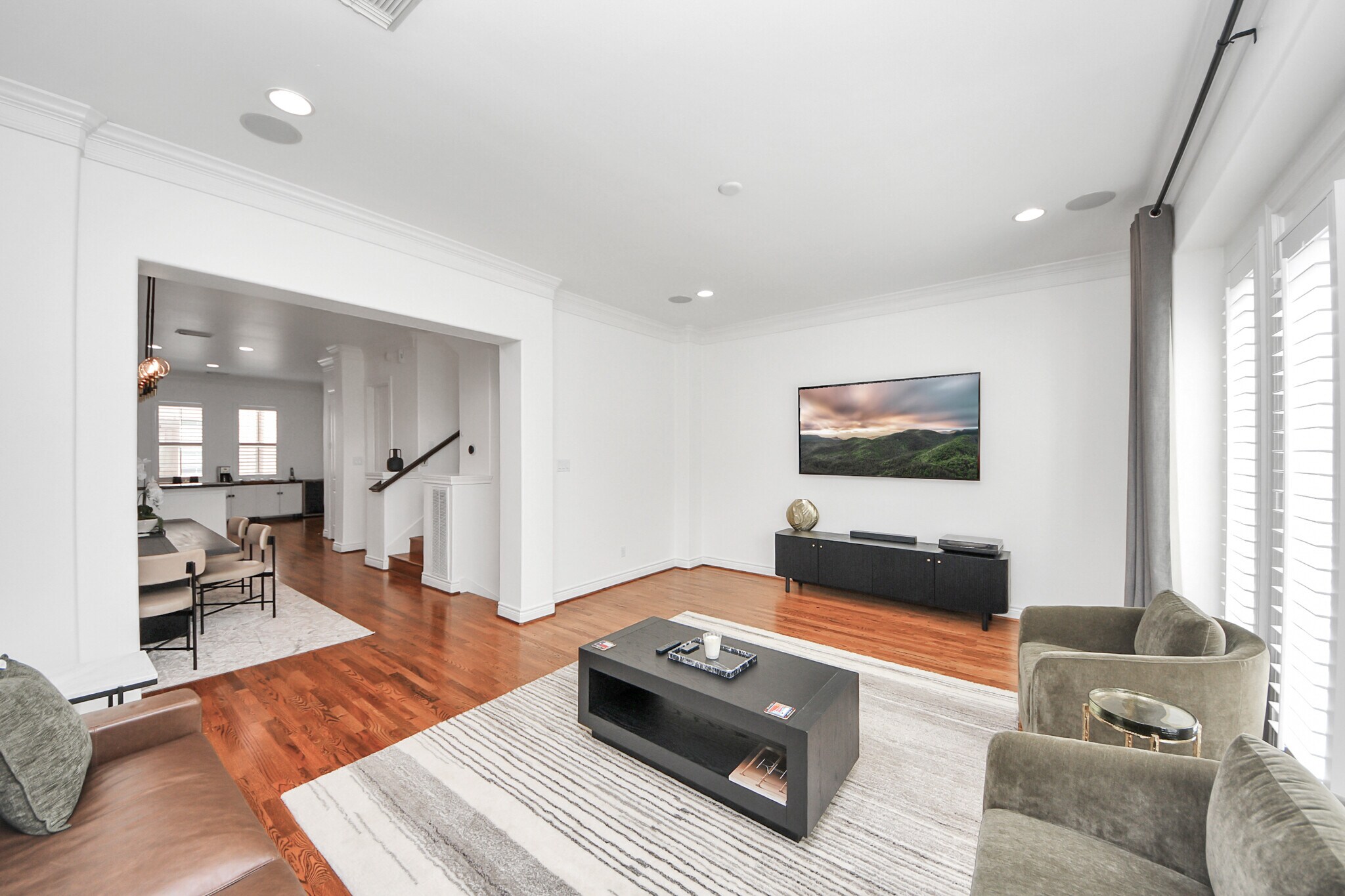 Sunlight dances through plantation shutters, framing the room in calm. - 620 Rutland St