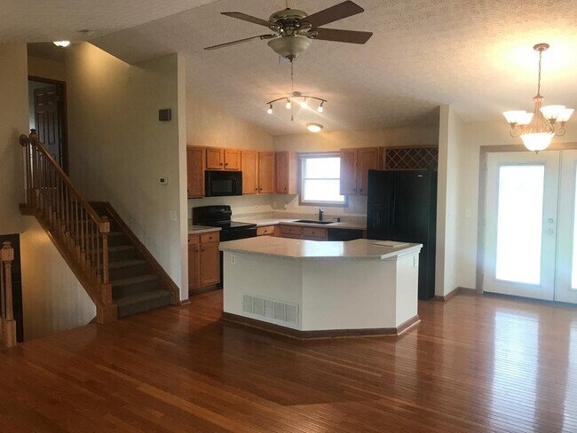 Kitchen & stairs to bedrooms - 8453 Olenbrook Dr