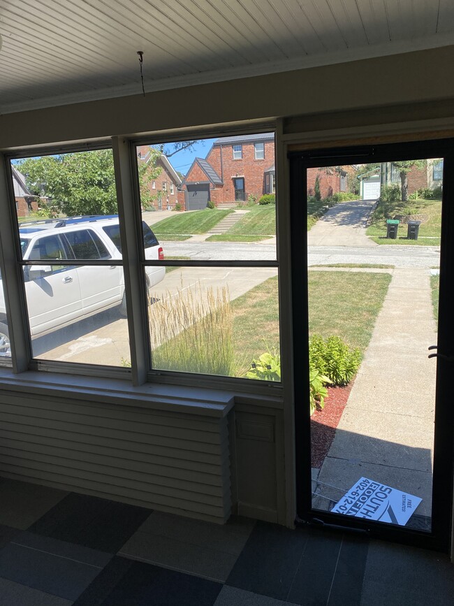 screened in porch on front of house - 4507 Walnut St