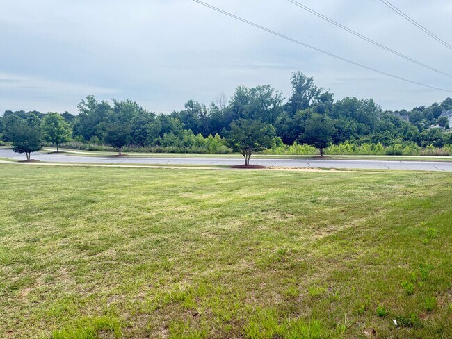 Building Photo - Beautiful Westbranch Home with 2-Car Garage, Covered Porch & Greenway Entrance Across the Street