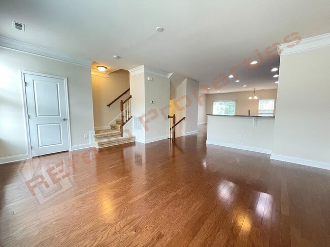 Building Photo - Beautiful 3 Story 3 Bedroom Townhouse with Huge 1st Floor Flex Space with Access to Patio + 2 Car...