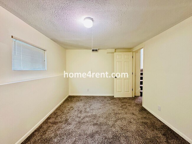 Building Photo - Olathe Duplex w/ Wood Floors, Finished Basement, and a Fenced Yard!