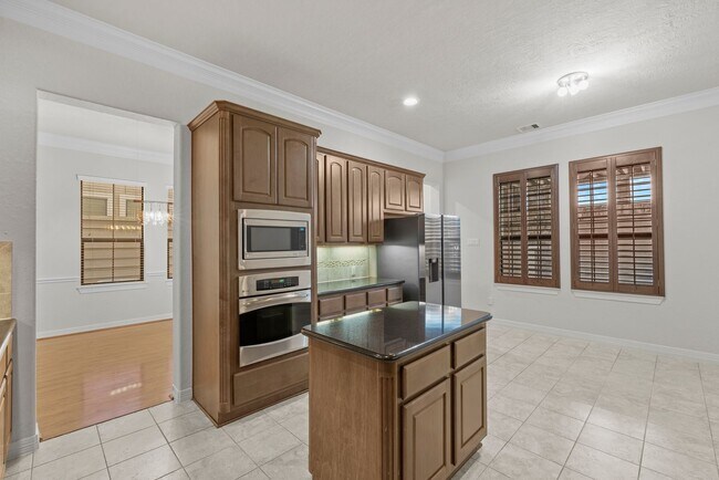 Building Photo - Luxury Townhome with Attached Garage & Outdoor Entertaining Area - $100 off first and second mont!