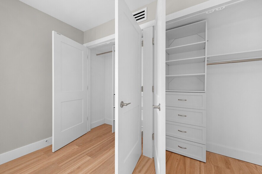 Bedroom Closet with Built In Cabinets - 20333 Detroit Rd