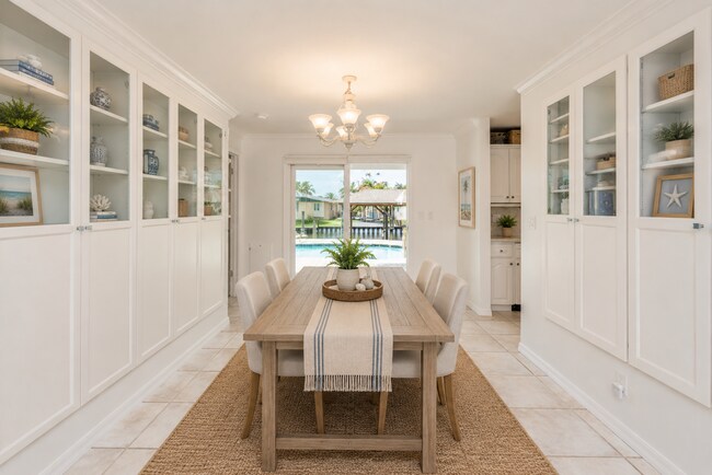 Building Photo - Live the ultimate Space Coast waterfront lifestyle at this stunning beachside canal home in Satel...