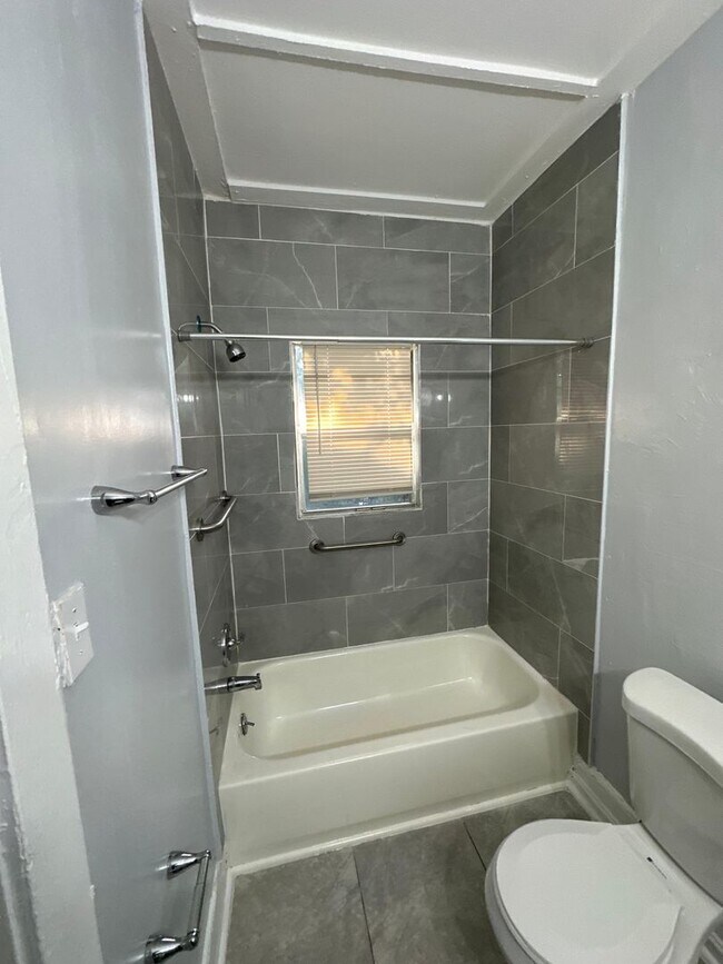 Building Photo - Fully Renovated 2/1 -Single Family Availab...