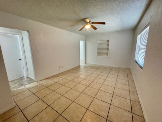 Building Photo - 4 Bedroom, 2 Bath House with Huge Fenced Yard, ALL Tile Floors!