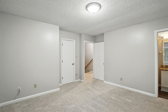 Building Photo - Spacious 2-Bedroom, 2.5-Bath End-Unit Town...