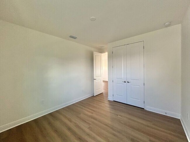 Building Photo - Gorgeous 4/3 Residence with a Private Back Lanai and a 3 Car Garage in the Delightful Laureate Pa...