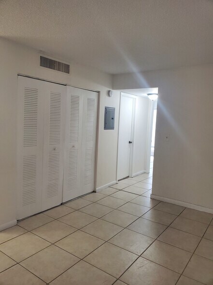 hallway with spacious closet - 10810 SW 88th St