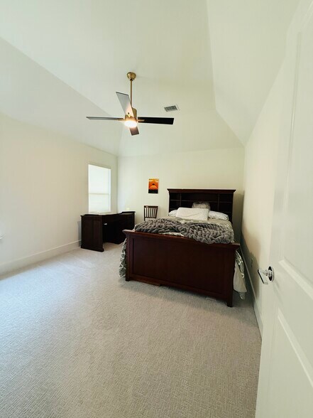 Bedroom 1 with office desk, chair - 2604 Bucer Ct