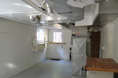 Spacious laundry and furnace room provides abundant storage and room for projects. - 9121 SW 35th Ave