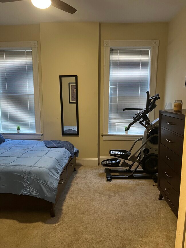 Primary Bedroom - Queen Sized Bed; 55-inch 4K Ultra Smart TV; Max Trainer 7 - 2219 Missouri Ave