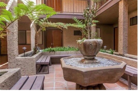 garden fountain - 14572 Dickens St