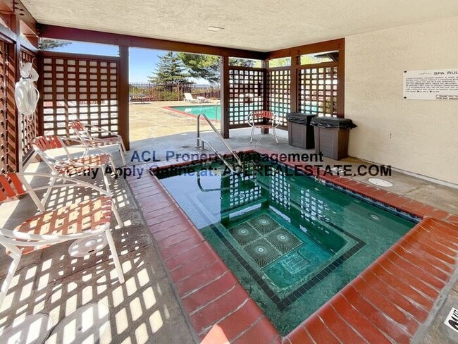Building Photo - Bright 2BR/2BA Condo with Garage & Pool in...