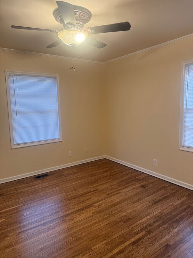 Building Photo - Step into this beautifully updated 1950's gem, where charm meets modern convenience