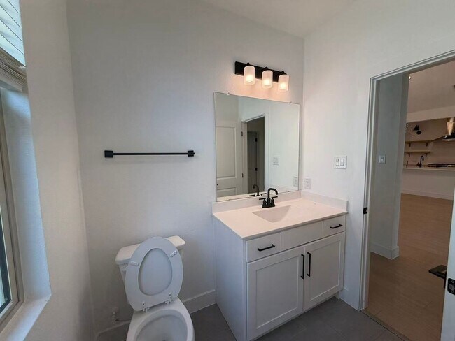 Building Photo - Move-in ready and like-new! Washer, dryer, and refrigerator Included.