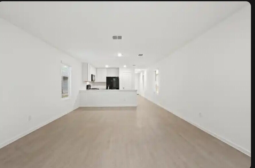 Another view from living room into kitchen - 726 Sandhill Crane Ln