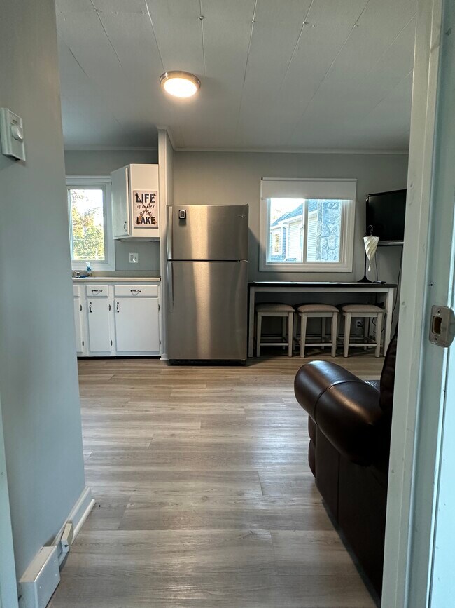 View from bedroom #2 into living room/kitchen. - 16 Crescent Beach Dr