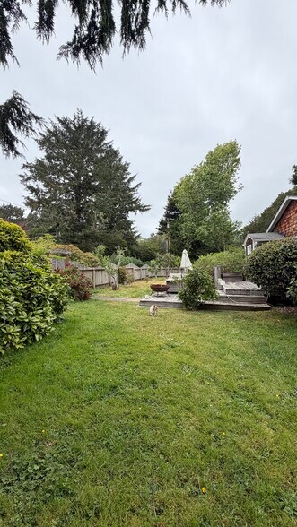 side yard with deck and Fruit Trees - 201 6th Ave