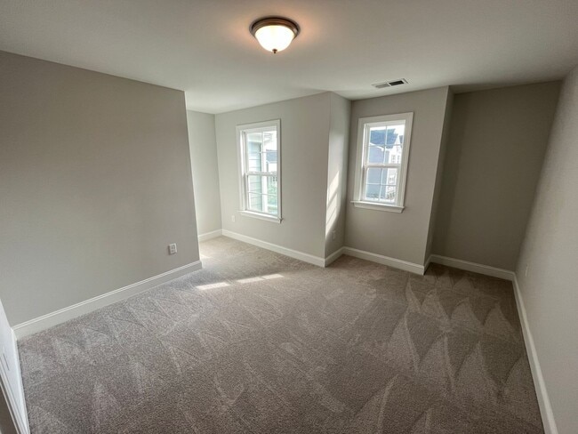 Building Photo - Newly Built 4BD, 3BA Cary Townhome with Modern Amenities and Screened-In Patio