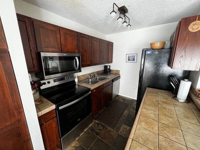 Building Photo - Furnished 2 bedroom 2 bath condo with assigned parking stalls