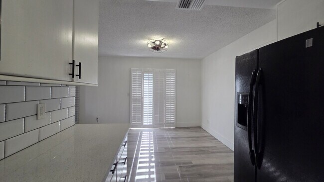 Building Photo - Beautifully remodeled pool home situated on a spacious quarter-acre lot