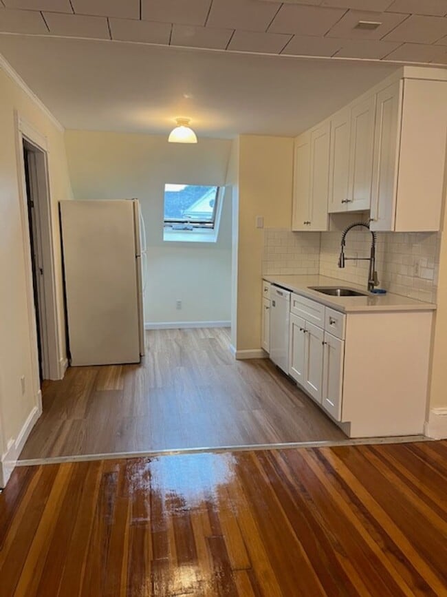 Building Photo - No Brokers Fee, Heat and Hot Water Included, Top Floor Unit, Steps from the T Stop, Eat-in Kitche...