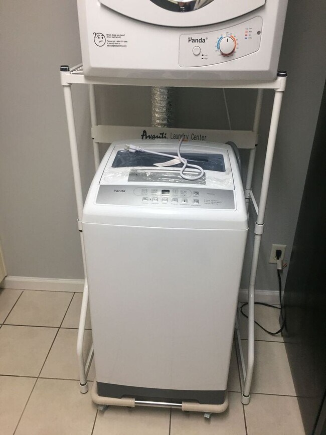 Building Photo - Beautiful 2/1B all tiled 2nd floor condo i...