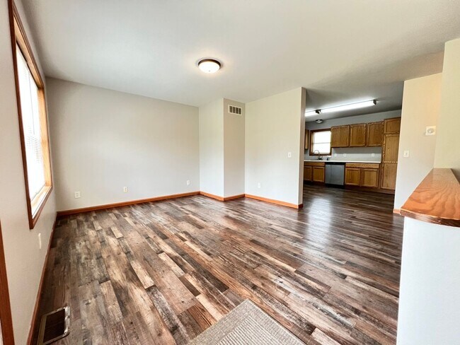 Building Photo - Spacious 3BR Duplex with Finished Basement & 2-Car Garage in Otsego