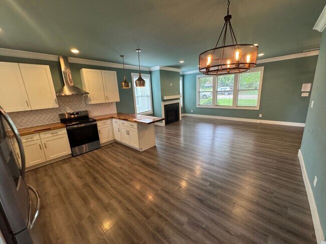 Building Photo - Modern Bungalow Charm: Designer Finishes & Expansive Backyard Living!