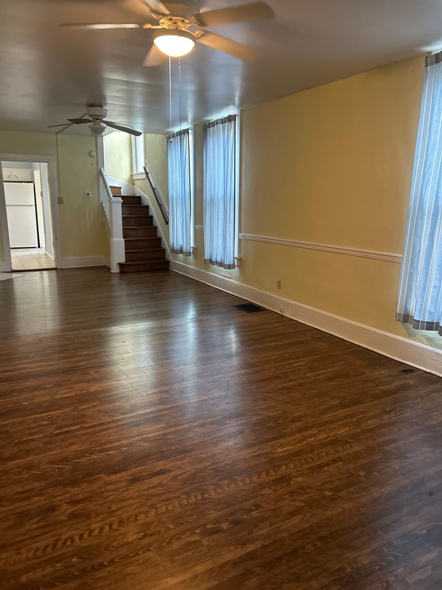Living room. Carpet has been removed from stairs and hardwood refinished - 2109 N 10th St