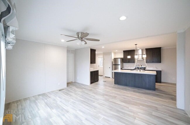 Building Photo - Spacious 4-Bedroom Home with Lawn Maintena...