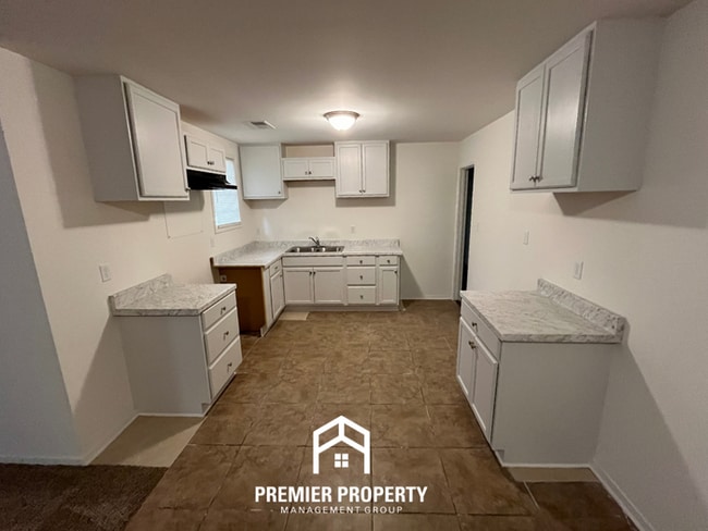Building Photo - Spacious 3BR/2BA Home with Den & Living Room | Brick Fireplace & Large Yard
