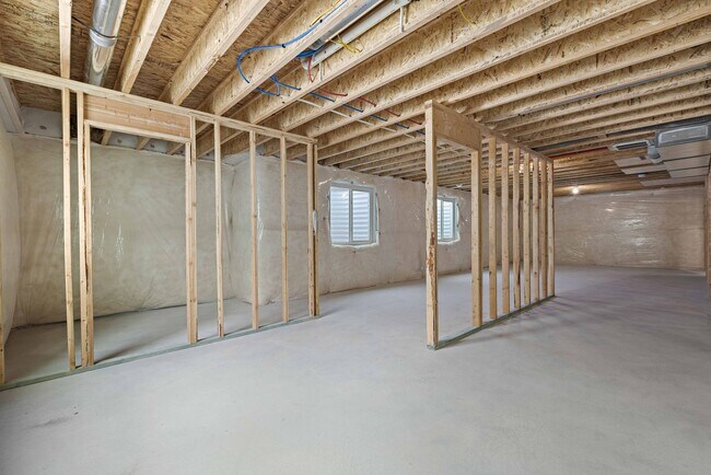 Building Photo - NEW HOME with large garage stalls and unfinished basement for additional storage