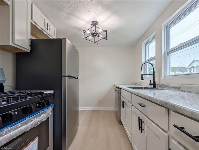 Building Photo - A Fresh Start on a Quiet Street – Everything new for you plus half off first months rent is waiting!