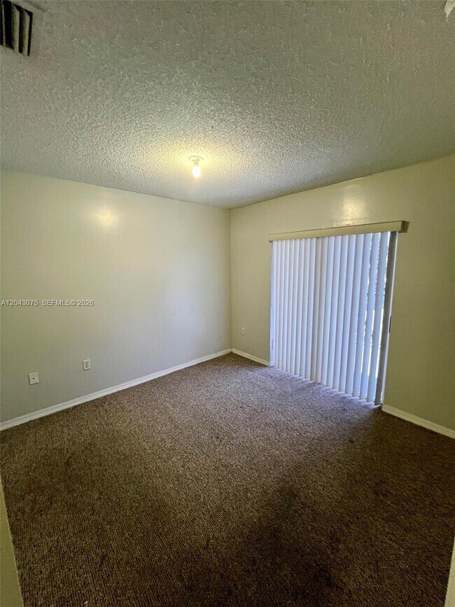 Building Photo - 6975 NW 173rd Dr