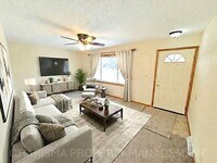 Building Photo - 4 BD, 2 BA - FENCED IN YARD, PRIVATE TRAILS, FINISHED UPPER AND LOWER LIVING AREAS, ATTACHED GARAGE!