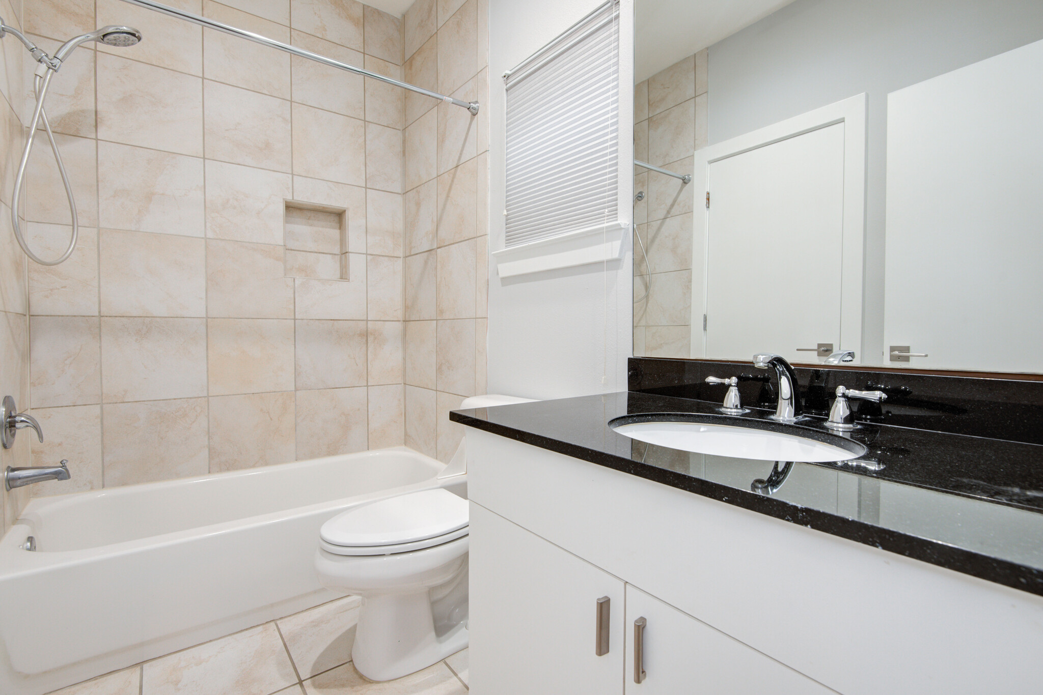 Bathroom for secondary bedroom. Connected to spacious walk-in closet (not pictured). - 4202 Spencer St