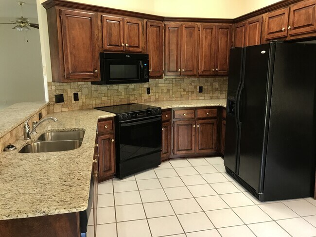 Building Photo - Beautiful granite and tile backsplash to update the large kitchen. 3 bedrooms + an office, large ...