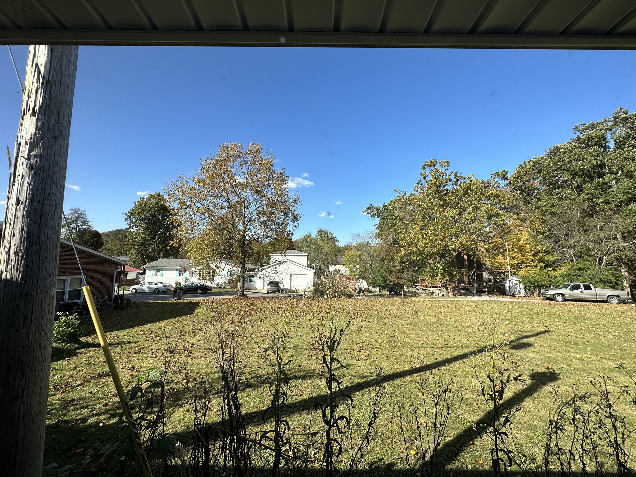 View of Yard - Nice properties border the property. - 6120 Pinedale Dr