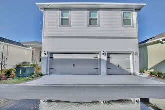 Building Photo - Modern 1/1 Garage Apartment Living in the Heart of Laureate Park!