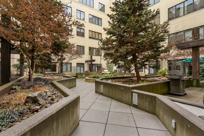 Building Photo - Chic, urban studio condo in the Pearl—Peaceful, In-unit w/d, 14-ft ceilings, deeded parking