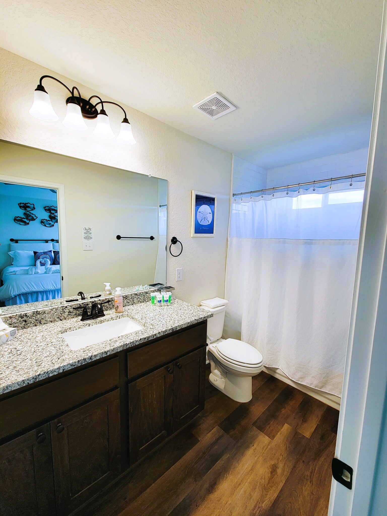 1 of 3 bathrooms. 2 full bathrooms and 1 half bathroom in common area. - 13810 Enzo Gate