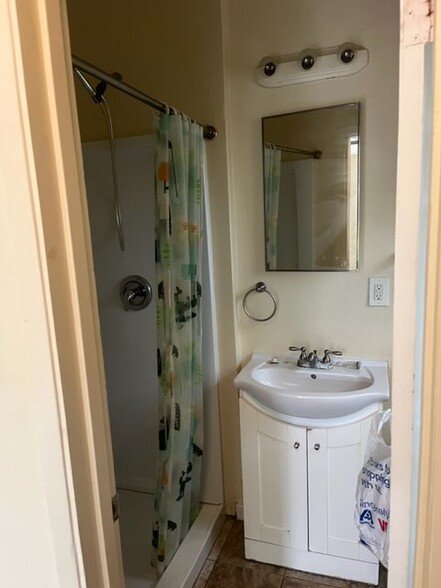 Bathroom with new shower enclosure & sink - 104 S Clementine St