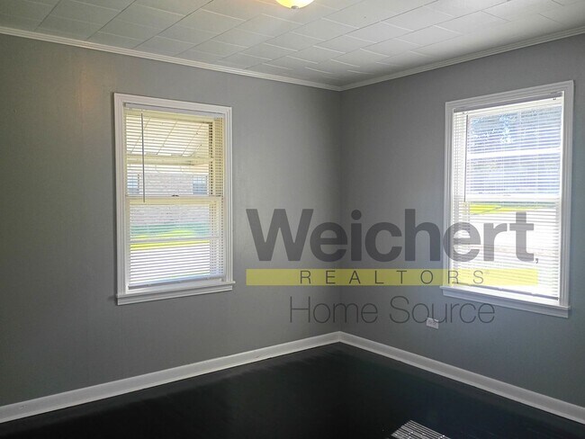 Building Photo - Quality finishes and adaptable design in a desirable location